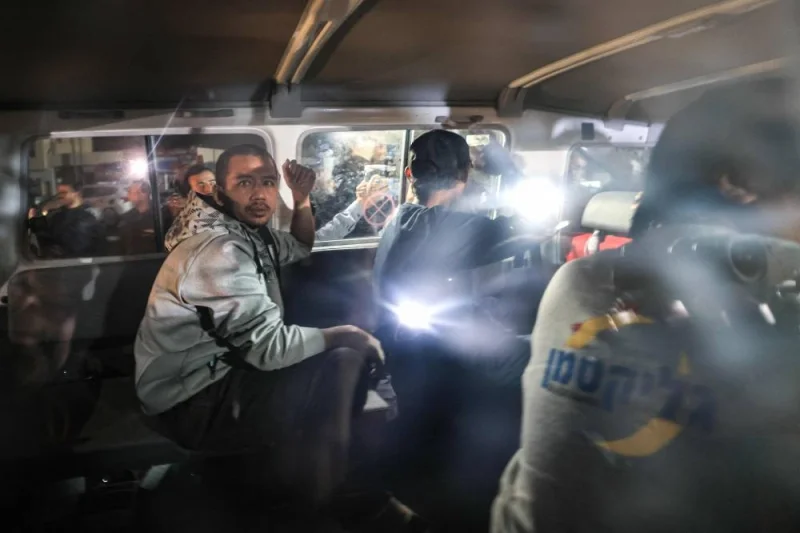 An International Red Cross vehicles reportedly carrying hostages released by Hamas in the Gaza Strip driving towards the Rafah border point with Egypt ahead of their transfer to Israel. AFP