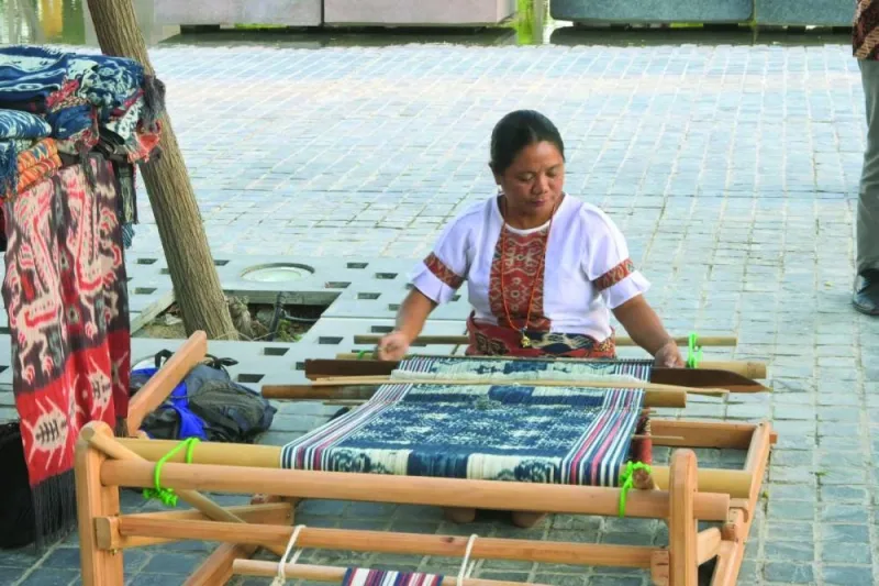 Right: An ikat weaving demonstration.