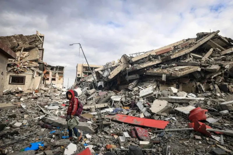 Palestinians inspect the destruction caused by Israeli strikes in Wadi Gaza, in the central Gaza Strip, on Tuesday. AFP