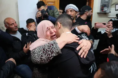Ahmad Salaima is welcomed by relatives upon his arrival at his home in Israeli-annexed east Jerusalem on Tuesday, after 30 Palestinian detainees were released under an extended truce deal. AFP