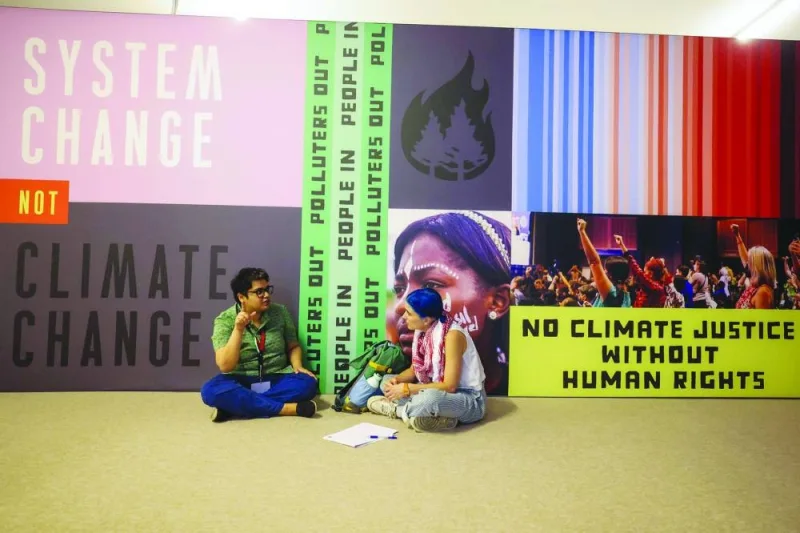 Pro-Palestinian environmental activists participate in a sit-in demonstration at the Expo City in Dubai yesterday, during the COP28 United Nations climate summit. 