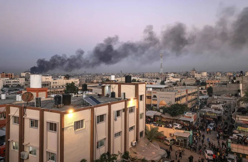 This picture taken in Khan Yunis in the southern Gaza Strip shows black smoke rising after an Israeli strike on a plastic factory, on Saturday. AFP