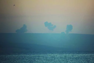 Smoke rises on the Lebanese side near the border with Israel, amid ongoing cross-border hostilities between Hezbollah and Israeli forces, as seen from Tyre, southern Lebanon, yesterday.
