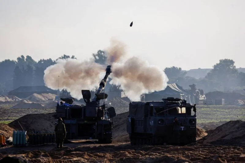 A mobile artillery unit fires in direction of Gaza Strip at the border with Gaza, in Israel, on Saturday. REUTERS