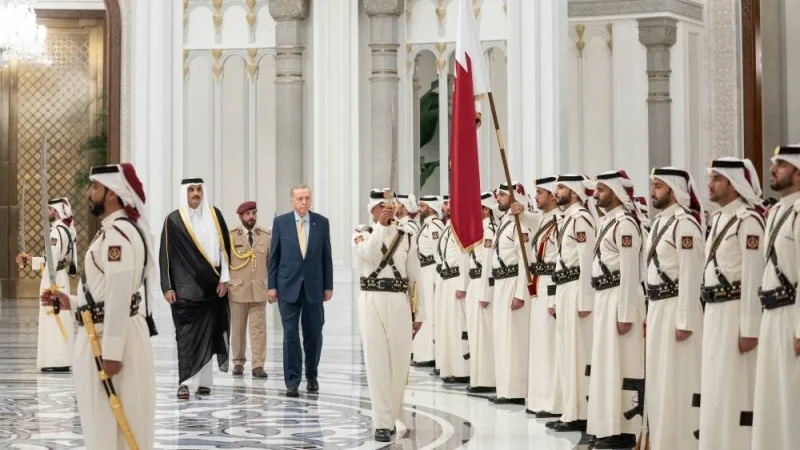 Accompanied by His Highness the Amir Sheikh Tamim bin Hamad Al-Thani, the President of Republic of Turkiye Recep Tayyip Erdogan inspects a guard of honour at Lusail Palace, during the official reception ceremony on Monday.