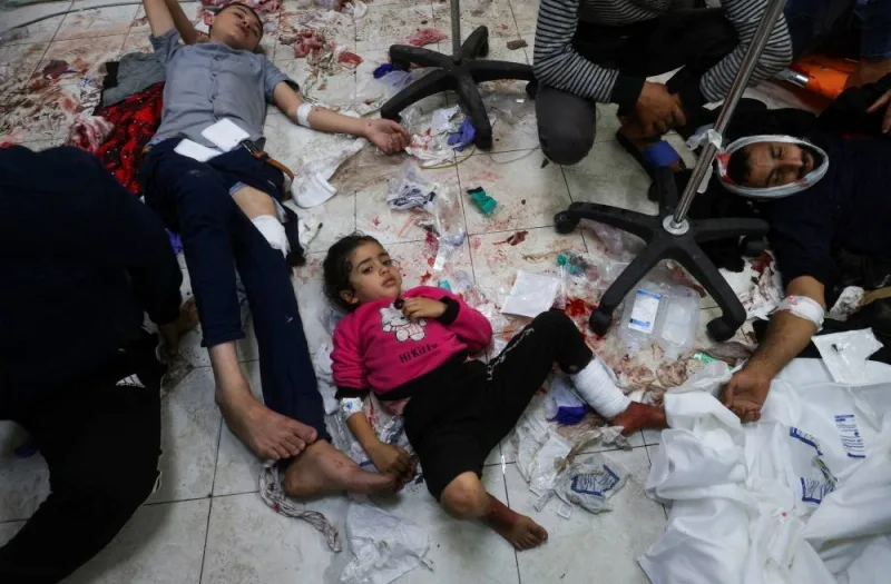 Wounded Palestinians lie on the floor at Nasser hospital, following Israeli strikes on Ma&#039;an school east of Khan Younis, in Khan Younis in the southern Gaza Strip, on Tuesday. REUTERS