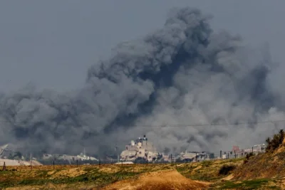 Smoke rises among buildings destroyed in Israeli strikes at the Israel-Gaza border as seen from southern Israel, on Wednesday. REUTERS