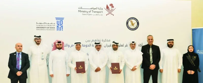 HE the Minister of Transport Jassim Saif Ahmed al-Sulaiti with QAA director general HE Sheikh Jabor bin Hamad al-Thani and UDST president Dr Salem al-Naemi and other officials after the signing of the MoU.