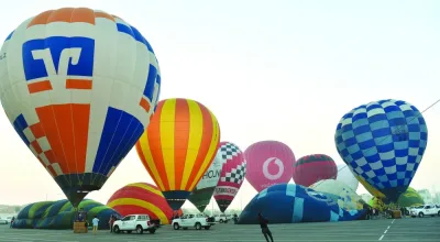 An array of hot air balloons take off near the Khalifa International Stadium, within Aspire Zone, on Friday as part of Qatar Hot Air Balloon Festival&#039;s daily &#039;Sunrise&#039; activity. PICTURE: Shaji Kayamkulam