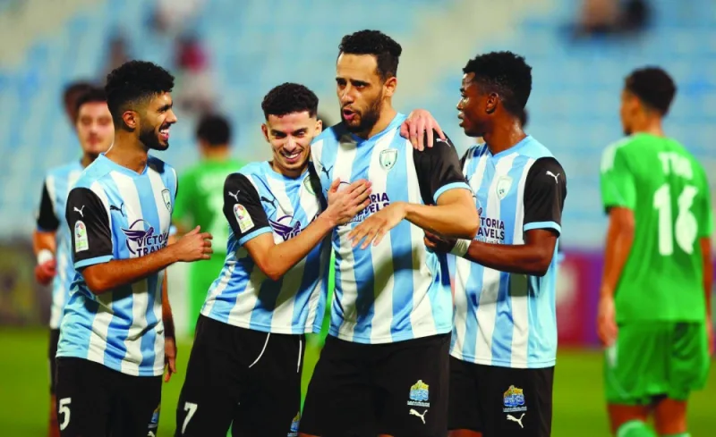 
Al Wakrah’s Mohamed Benyettou (second right) celebrates with teammates after scoring against Al Ahli during the Expo Stars League at the Saoud Bin Abdulrahman Stadium yesterday. 