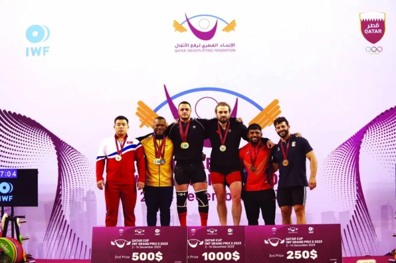 Podium finishers in the men&#039;s 89kg competition seen with officials.