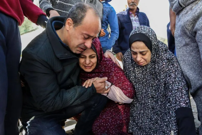 KHAN YUNIS, GAZA - DECEMBER 09: (EDITOR'S NOTE: The photo depicts death): Relatives and friends of Muhammad Abdullah Hasaballah, a 22-year-old man killed by air strikes in Khan Yunis, react as they attend the funeral of his body on December 09, 2023 in Khan Yunis, Gaza. Gaza's Hamas-run health ministry announced that more 17,700 Gazans have been killed since Oct. 7, including more than 7,000 children. Israel has stepped up military operations in Gaza after a weeklong truce between Hamas and Israel ended at the beginning of the month, despite diplomatic negotiations and the release of some Israeli hostages and Palestinian prisoners. (Photo by Ahmad Hasaballah/Getty Images)