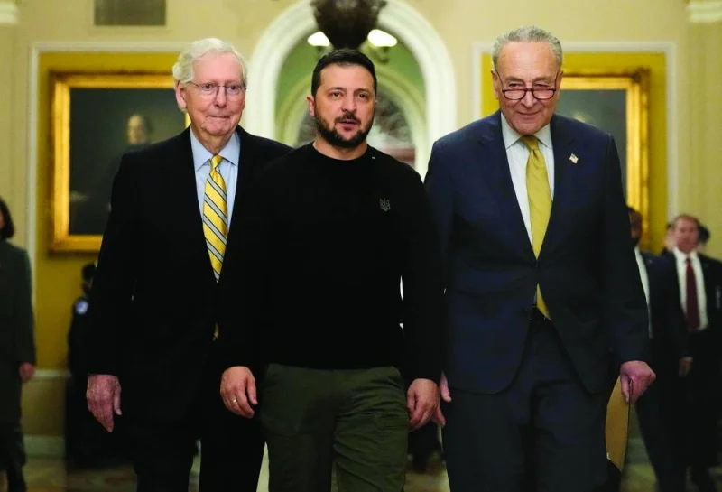 Ukrainian President Volodymyr Zelensky (centre) walks with Senate Minority Leader Mitch McConnell (left) and Senate Majority Leader Charles Schumer as he arrives at the US Capitol to meet with Congressional leadership yesterday in Washington, DC. (AFP)