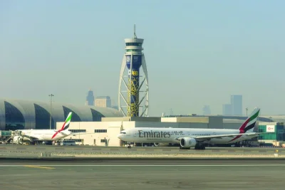 Passenger aircraft, operated by Emirates Airlines, on the tarmac at Al Maktoum International Airport in Dubai. Airlines in the Middle East are expected to post profits of $2.6bn this year and $3.1bn in 2024 on higher revenues from good passenger load even as the region&#039;s international air connectivity already exceeding 105% of pre-Covid levels.