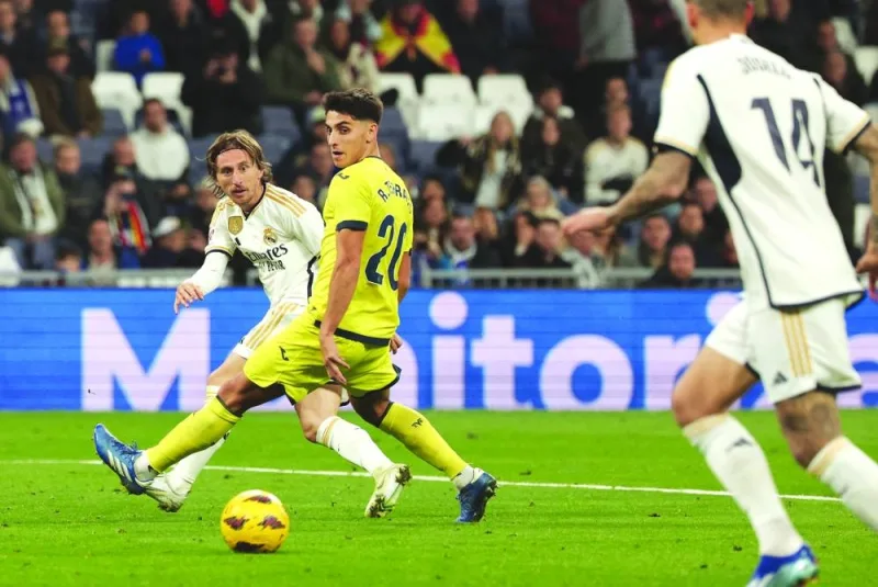 
Real Madrid’s Luka Modric (left) vies for the ball with Villarreal’s Spanish Ramon Terrats during the La Liga match at the Santiago Bernabeu stadium in Madrid on Sunday. (AFP) 