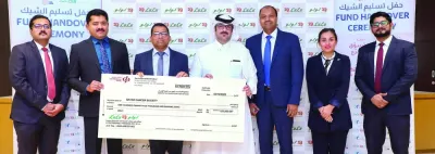 Officials of LuLu Hypermarket Qatar and Qatar Cancer Society at the handover of a ceremonial cheque for QR125,000.