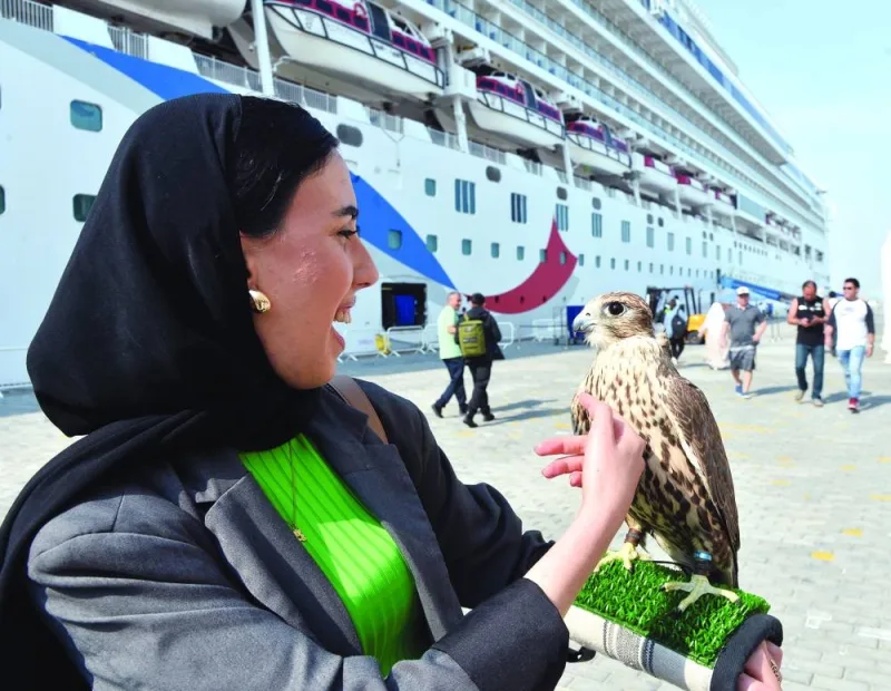 Cruise tourists are given a warm welcome at Doha Port, with the Norwegian Dawn in the background. PICTURES: Shaji Kayamkulam.