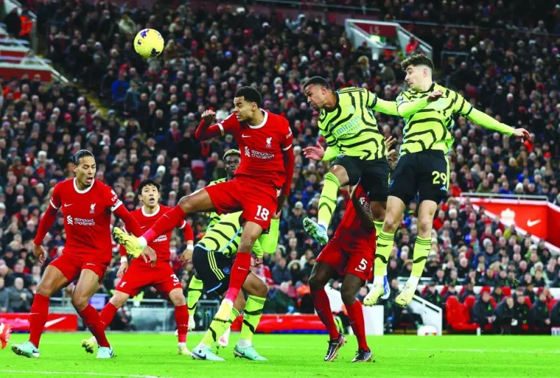 Arsenal’s Gabriel (second right) scores a header against Liverpool during the Premier League match at the Anfield in Liverpool on Saturday. (Reuters)