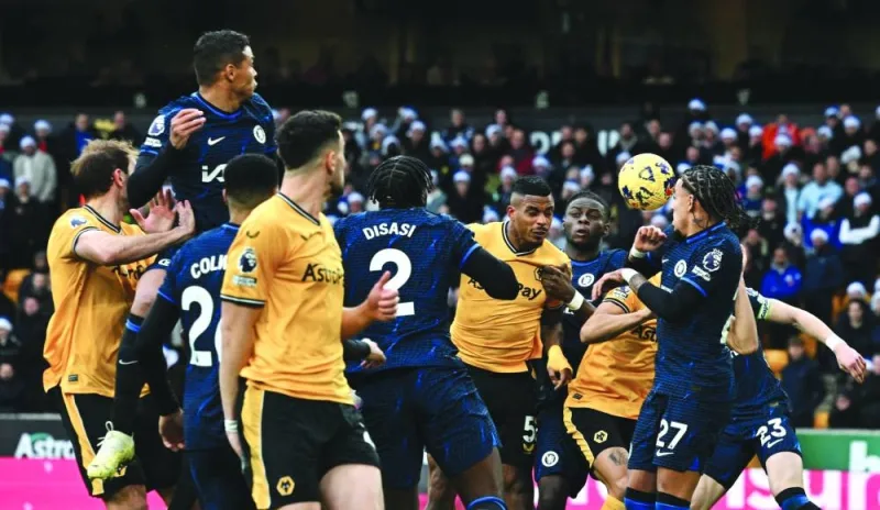 
Wolverhampton Wanderers’ Mario Lemina (fifth right) heads the ball to score against Chelsea during the Premier League match. (AFP)  
