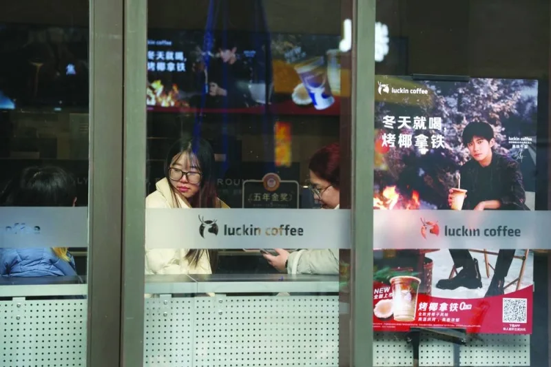 
Customers wait for coffee in a Luckin Coffee store in Beijing. (Reuters) 