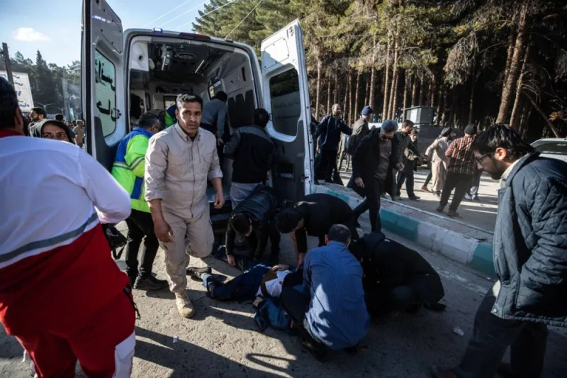 Iranian emergency services arrive at the site where two explosions in quick succession struck a crowd marking the anniversary of the 2020 killing of Guards general Qasem Soleimani, near the Saheb al-Zaman Mosque in the southern Iranian city of Kerman on Wednesday. AFP