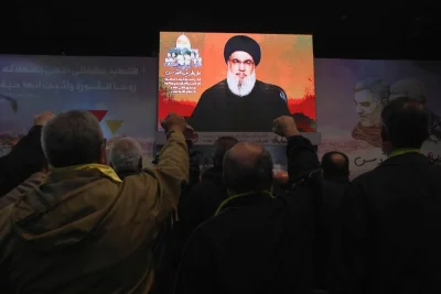 Lebanon&#039;s Hezbollah leader Sayyed Hassan Nasrallah addresses his supporters through a screen during a ceremony to mark the fourth anniversary of the killing of senior Iranian military commander General Qassem Soleimani in a US attack, in Beirut&#039;s southern suburbs, on Wednesday. REUTERS