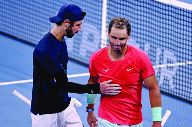 Australia’s Jordan Thompson (left) and Spain’s Rafael Nadal gesture after the former’s win in the Brisbane International in Brisbane on Friday. (AFP)