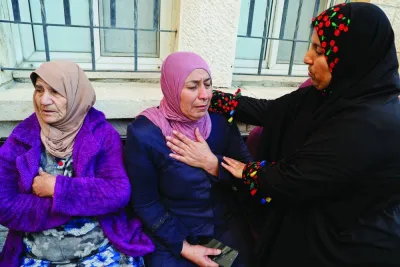 
A woman wearing the pink hijab mourns, after four of  her children were killed in what Palestinian authorities said was an Israeli air strike, at a morgue in Jenin in the occupied West Bank, yesterday. 