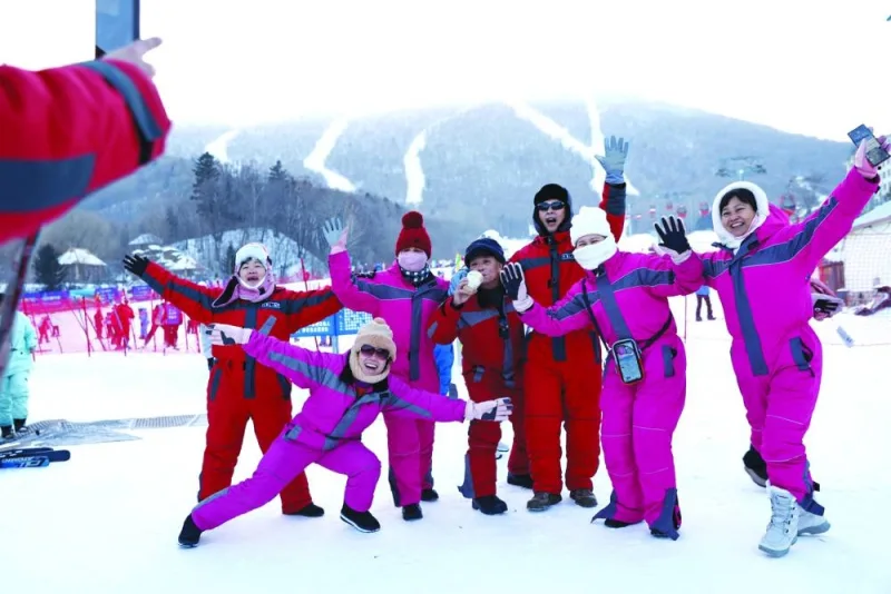 
Skiers pose for pictures at the Yabuli ski resort in Harbin, Heilongjiang province, China. 