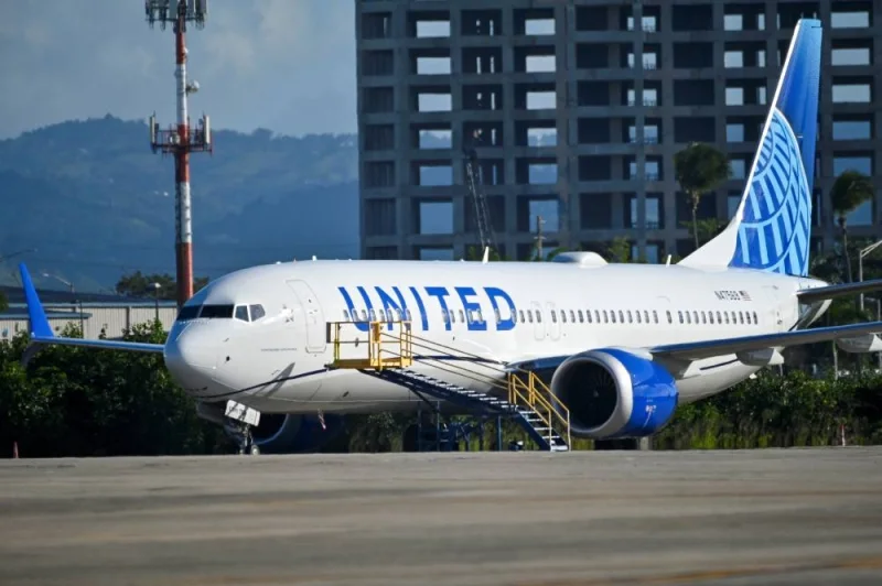 A United Airlines Boeing 737 MAX 9 jetliner is grounded, as passengers try to rebook their tickets from cancelled United Airlines flights after US air safety regulator the Federal Aviation Administration grounded 171 Boeing 737 MAX 9 jetliners. REUTERS