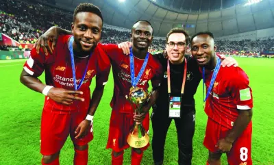 Jose Luis Rodriguez (second right) poses with the Liverpool players Sadio Mane (second left), Naby Keita (right) and Divock Origi after the Premier League side won the FIFA Club World Cup at the Khalifa International Stadium on December 21, 2019.
