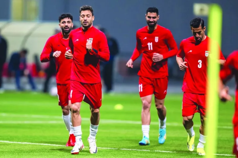 Iran players warm up before a training session in Doha on Saturday.