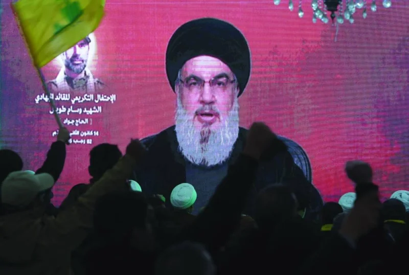 
Lebanon’s Hezbollah leader Sayyed Hassan Nasrallah gives a televised address at a memorial ceremony to mark one week since the killing of Wissam Tawil, a commander of Hezbollah’s elite Radwan forces, in Khirbet Silem, southern 
Lebanon, yesterday. 