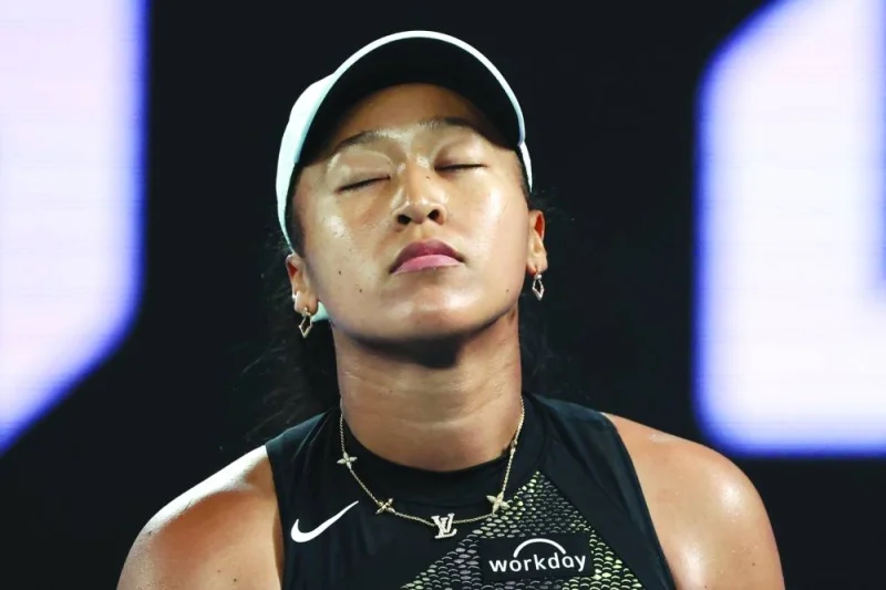 Japan&#039;s Naomi Osaka reacts after losing against France&#039;s Caroline Garcia in their match on day two of the Australian Open in Melbourne on Monday. (AFP)