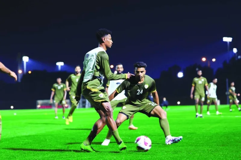 Oman players train in Doha on Monday, ahead of their game against Saudi Arabia.