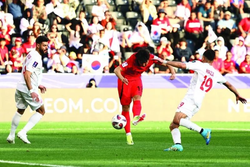 
South Korea’s Lee Kang-in (centre) scores against Bahrain during the Asian Cup match at the Jassim Bin Hamad Stadium. (Reuters)  