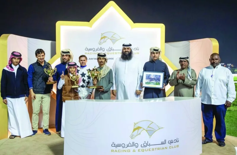 Connection of Toromona celebrate with the trophy after the bay gelding won the Khor Al Adaid Cup at the Al Rayyan Racecourse on Thursday. PICTURES: Juhaim