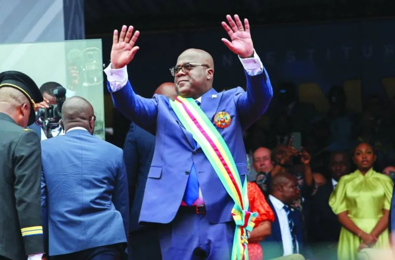 Tshisekedi waves as he arrives to be sworn in for a second term as president during the inauguration ceremony at Kinshasa&#039;s Martyrs Stadium.