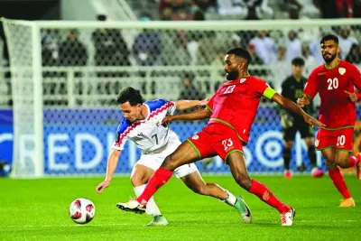 
Thailand’s midfielder (7) Supachok Sarachat and Oman’s midfielder (23) Harib al-Saadi vie for the ball during the AFC Asian Cup2023 Group F match at the Abdullah Bin Khalifa Stadium in Doha 
yesterday. (AFP) 
