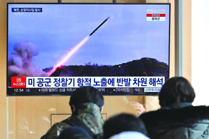People watch a television screen showing a news broadcast with file footage of a North Korean missile test, at a railway station in Seoul on Wednesday.