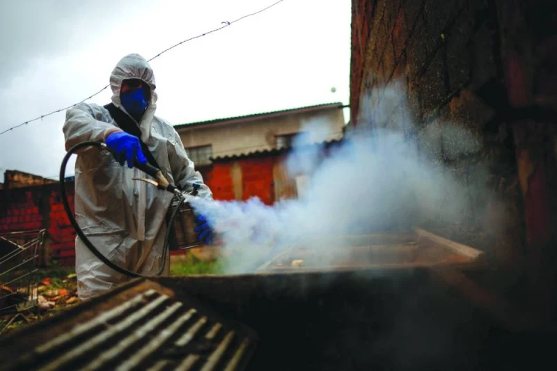 
Health workers sprays insecticide to kill the Aedes aegypti mosquito to help mitigate a dengue outbreak in the Ceilandia neighbourhood of Brasilia. 