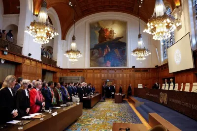Officials stand on the day the International Court of Justice (ICJ) rule on emergency measures against Israel following accusations by South Africa that the Israeli military operation in Gaza is a state-led genocide, in The Hague, Netherlands, on Friday. REUTERS