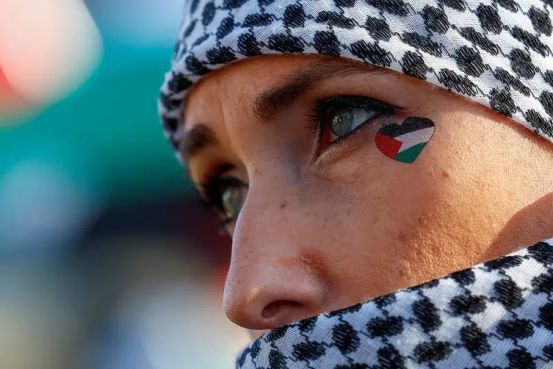 A person attends a pro-Palestinian demonstration outside the International Court of Justice (ICJ) as judges rule on emergency measures against Israel following accusations by South Africa that the Israeli military operation in Gaza is a state-led genocide, in The Hague, Netherlands, on Friday. REUTERS