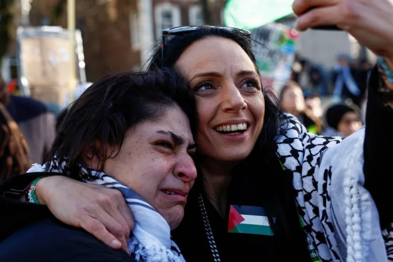 Women react during a pro-Palestinian demonstration outside the International Court of Justice (ICJ) as judges rule on emergency measures against Israel following accusations by South Africa that the Israeli military operation in Gaza is a state-led genocide, in The Hague, Netherlands, on Friday. REUTERS