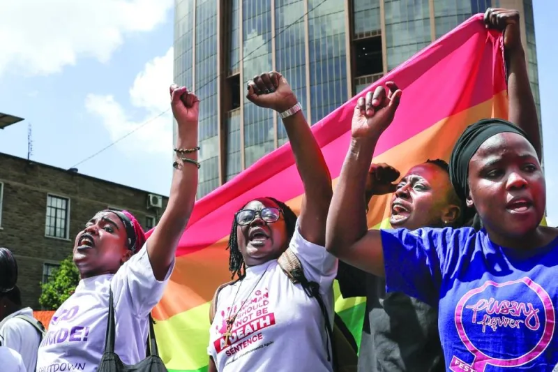 Protesters shout slogans as they march through Nairobi&#039;s Central Business District at a demonstration over an alarming rise in murder of young women.