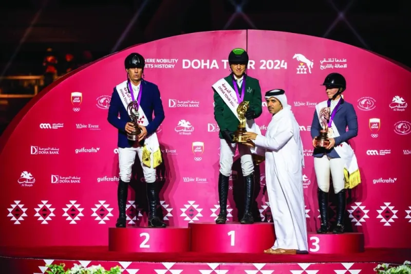 President of the Qatar Equestrian Federation (QEF) Bader al-Darwish presenting the trophy to Saudi Arabia’s Abdullah Alsharbatly at Al Shaqab Outdoor Arena in Doha on Saturday.