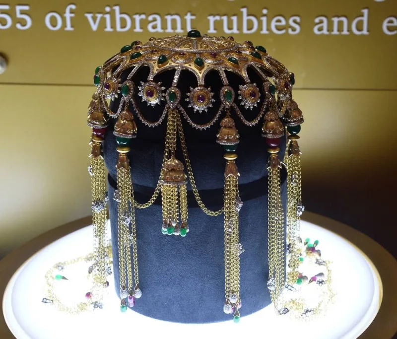 A vintage Gub-Gub headpiece made of gold, diamonds, rubies, and emeralds.