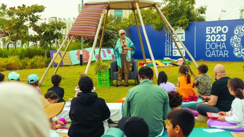 Dr Goodall with children at Al Bidda Park.