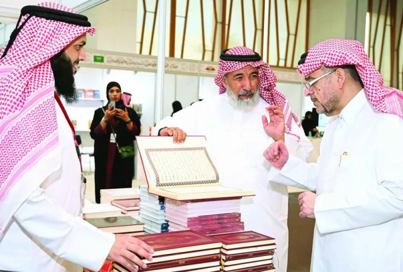 HE the Minister of Endowments (Awqaf) and Islamic Affairs Ghanem bin Shaheen bin Ghanem al-Ghanim and QU president Dr Omar al-Ansari tour the QU Book Fair 2024.
