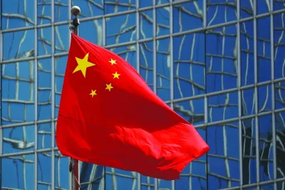 
The Chinese national flag is seen in Beijing. China pledged to keep spending this year despite a property market slump weighing on key government revenue sources, raising hopes that fiscal expansion can provide more support for a slowing economy. 